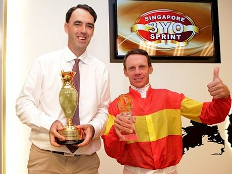 Shane Baertschiger with John Powell, who is No.1 stable rider for Lincoln Farms, after his win with Be Bee in the Three-Year-Old Sprint at Easter.