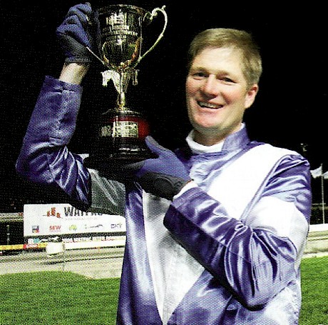 Derek Balle with the Interdominion Final trophy.