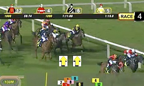Miracle Time is probing through a gap as Rock Me Easy keeps fighting against the rails 130 metres from the finish last night.