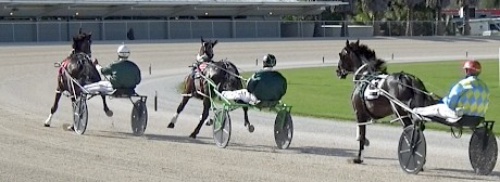 Man Of Action is green, running wide when leading on the bend out of the home straight.