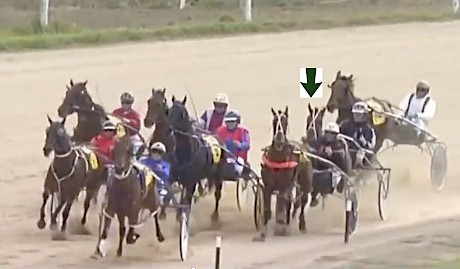 Barkley and Chris McDowell, arrowed, are badly held up by the tiring trailer Out Of The Shadows turning for home at Oamaru on Saturday.