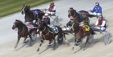 Near the finish of the trial and those blue colours of Mark Purdon are lurking ominously right in behind on Smooth Deal.