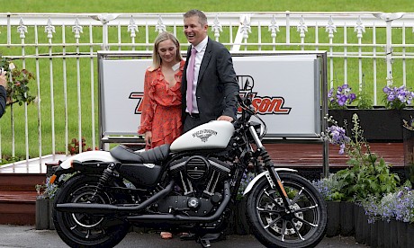 Stephen Marsh and partner Danielle Johnson with the new Harley Davidson he won at Ellerslie yesterday.