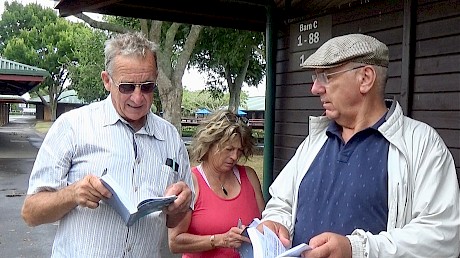 Doing the hard yards inspecting yearlings … from left, trainer Ray Green and wife Debbie, with Emilio Rosati.