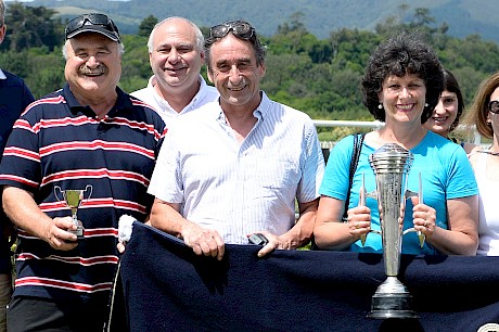 Steve Hollander, left, and wife Karen enjoying the spoils of Wellington Cup and Otaki Cup winner Jet Black Shadow with the writer. PHOTO: Royden Williams.