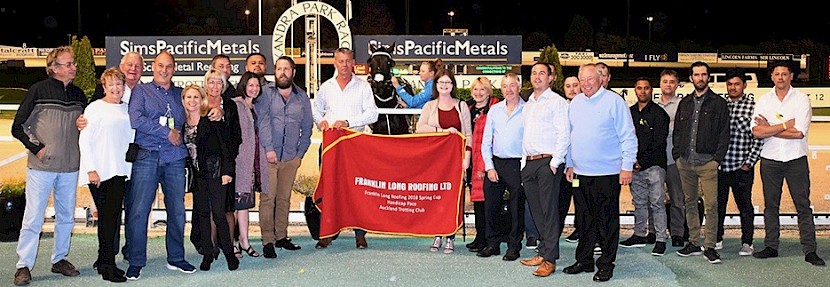 Hustler’s owners and friends celebrating in the winners’ circle at Alexandra Park. PHOTO: Joel Gillan/Race Images.