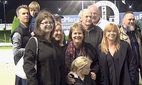 Shannon Flay, front left, sharing the fun of winning with her fellow owners, young and old, at Alexandra Park.