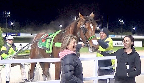 Amy Poutama, right, and Debbie Green, wife of trainer Ray Green, with Take No Prisoners after his win.