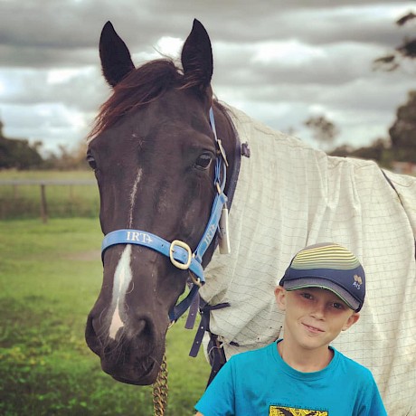 Trojan Banner is still a colt but he loves his cuddles. He’s pictured here with Chase Saunders, nephew of Barnes’ partner Cassie Saunders.