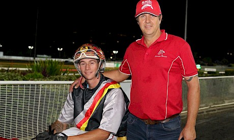 Trainer Al Barnes with driver son Hayden after Northview Hustler’s terrific win in the Flashing Red last season. PHOTO: Dan Costello.