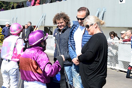Trainer Lisa Latta with co-owner Neville McAlister and ex New Zealand cricketer Hamish Marshall, listen to rider Robbie Hannam’s report after Platinum Dubai’s win. PHOTO: Peter Rubery/Race Images.