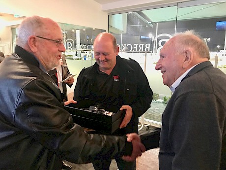 Woodlands Stud’s Steve Cornwall congratulates Bob Best, right, as son Brian checks out the trophy.