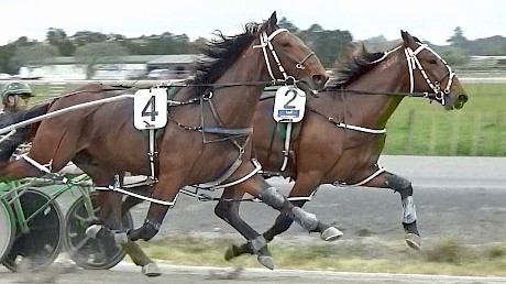 Captain Nemo leads with Platinum Stride ranging alongside turning for home.