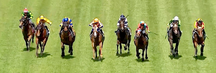They’re right across the track and Lincoln King is mounting his winning run at extreme right.
