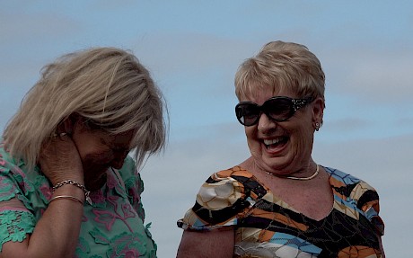 Lynne Street shares a joke with trainer Lisa Latta on the victory dais.