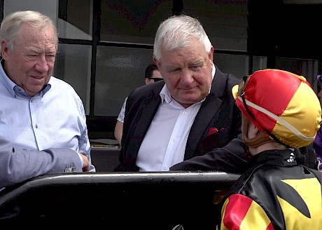 Lincoln Farms’ John Street, left, and Ian Middleton listen to rider Danielle Johnson’s report on Lincoln King after the Dunstan Final.