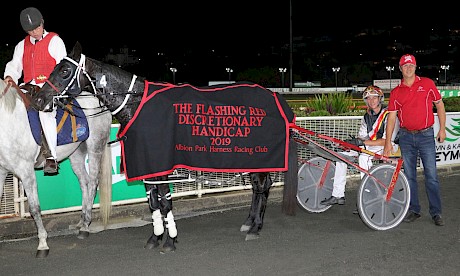 Northview Hustler, with trainer Al Barnes and his son Hayden after winning the Flashing Red last season. PHOTO: Dan Costello.