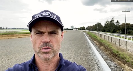 Cambridge Jockey Club CEO Mark Fraser-Campin with the new synthetic training track behind him.