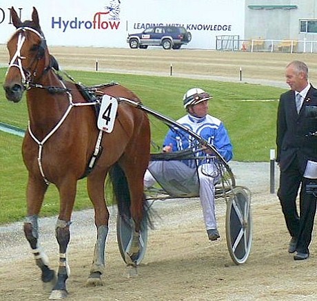 Greg O’Connor in his most recognised role on track - interviewing winning driver Mark Jones after his Dominion Handicap win behind Master Lavros.