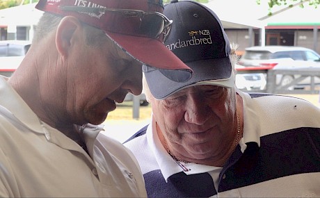 Al Barnes, left, checks out the pedigree of a yearling with Lincoln Farms boss John Street at the Karaka standardbred sale.