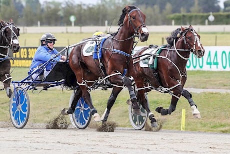 American Dealer sweeps up the passing lane to nail It’s All About Faith. PHOTO: Ajay Berry/Race Images.