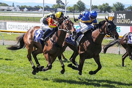 Danielle Johnson, outer, is riding hard on Lincoln King but Craig Grylls just has her covered on Dragon Storm. PHOTO: Ajay Berry/Race Images.