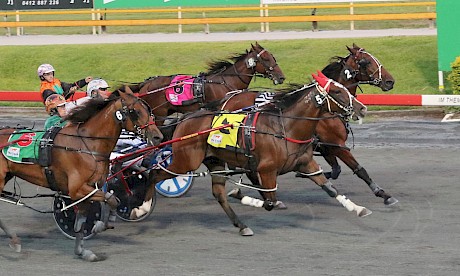 Larry Lincoln (red hood) pierces through the centre for Hayden Barnes and gets up in the last stride to nail Our Madiba at Albion Park last Saturday night. PHOTO: Dan Costello.