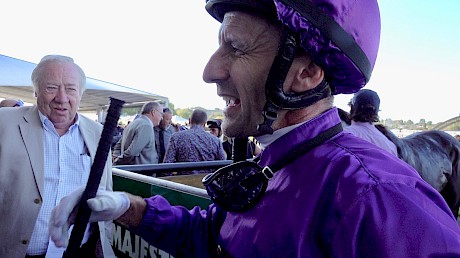 POST MORTEM: Co-owner John Street listens to Leith Innes describe his ride on Platinum Invador in the Auckland Cup.