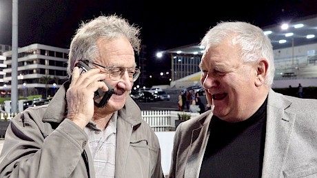 Trainer Ray Green, on the phone to owner Merv Butterworth, with Lincoln Farms business manager Ian Middleton.