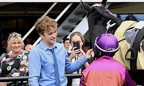 Lisa Latta looks on as her son Josh greets yet another winner for the stable. PHOTO: Peter Rubery/Race Images.