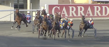 Turning for home and Tommy Lincoln is airborne, making his run very wide at the extreme left.