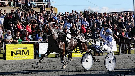 Zachary Butcher salutes the Cambridge crowd as Sky Major wins the second of his three Jewels in 2014.