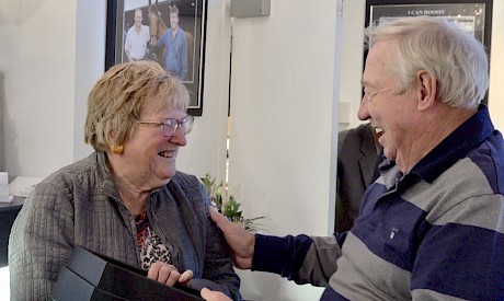 John Street presents Priscilla Edmunds with the race trophy.