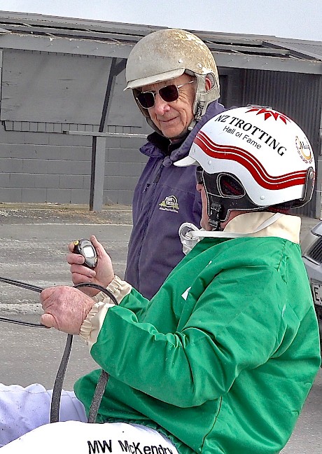 Maurice McKendry reads out Copy That’s sectionals to trainer Ray Green after the heat.