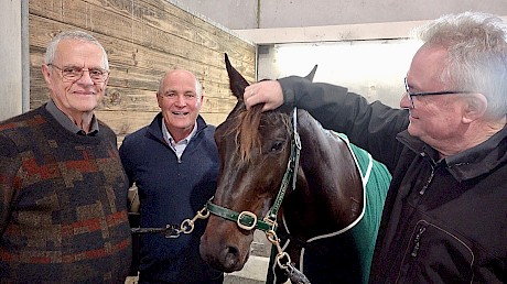 Well done River … David Turner, right, Phil Kelly, middle, and David Hooker with their champ after the race.