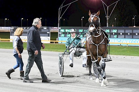 Trainer Ray Green and wife Debbie greet Zachary Butcher on his return with Copy That. PHOTO: Chanelle Lawson.