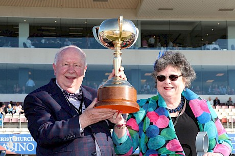 Merv and Meg Butterworth hoist their third New Zealand Cup after Copy That last year and Arden Rooney in 2015. PHOTO: Ajay Berry/Race Images.