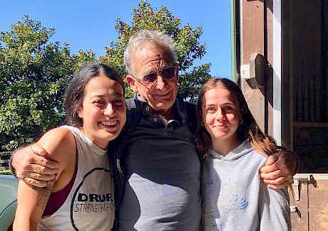 Stable workers Monika Ranger, left, and Brianna Thomas, welcome Ray Green back.