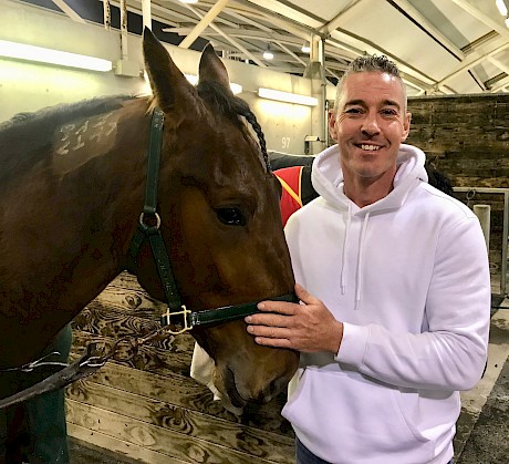 Accomplished golfer Gareth Paddison makes friends with Captain Nemo, in whom he was gifted a share by Lincoln Farms’ owner John Street after finishing second in the 2020 Wairakei Invitational.