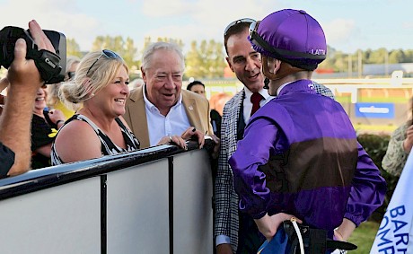 Trainer Lisa Latta and owners John Street and Neville McAlister hear Ryan Elliot’s report. PHOTO: Megan Liefting/Race Images.