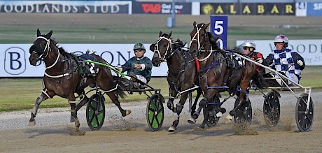 Lincoln Lou sprints up the passing lane but Iron Brigade, outer, is closing in. PHOTO: Megan Liefting/Race Images.
