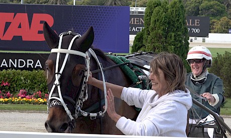 Part-owner Debbie Green greets Debbie Lincoln and driver Maurice McKendry after an earlier win.