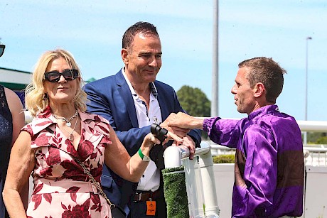Co-owner Neville McAlister and his partner Rochelle Dudding get a post-race rundown from jockey Craig Grylls after Platinum Attack’s Pegasus annihilation. PHOTO: Ajay Berry/Race Images.
