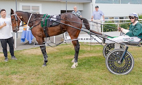 Co-trainer Nathan Delany gives the thumbs up to Spiritual Bliss and driver Harrison Orange. PHOTO: Jack McKenzie/Race Images.